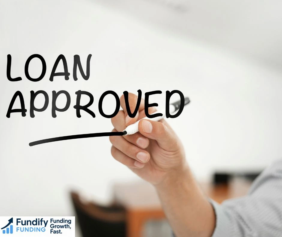 Business owner reviewing finance options with a low credit score